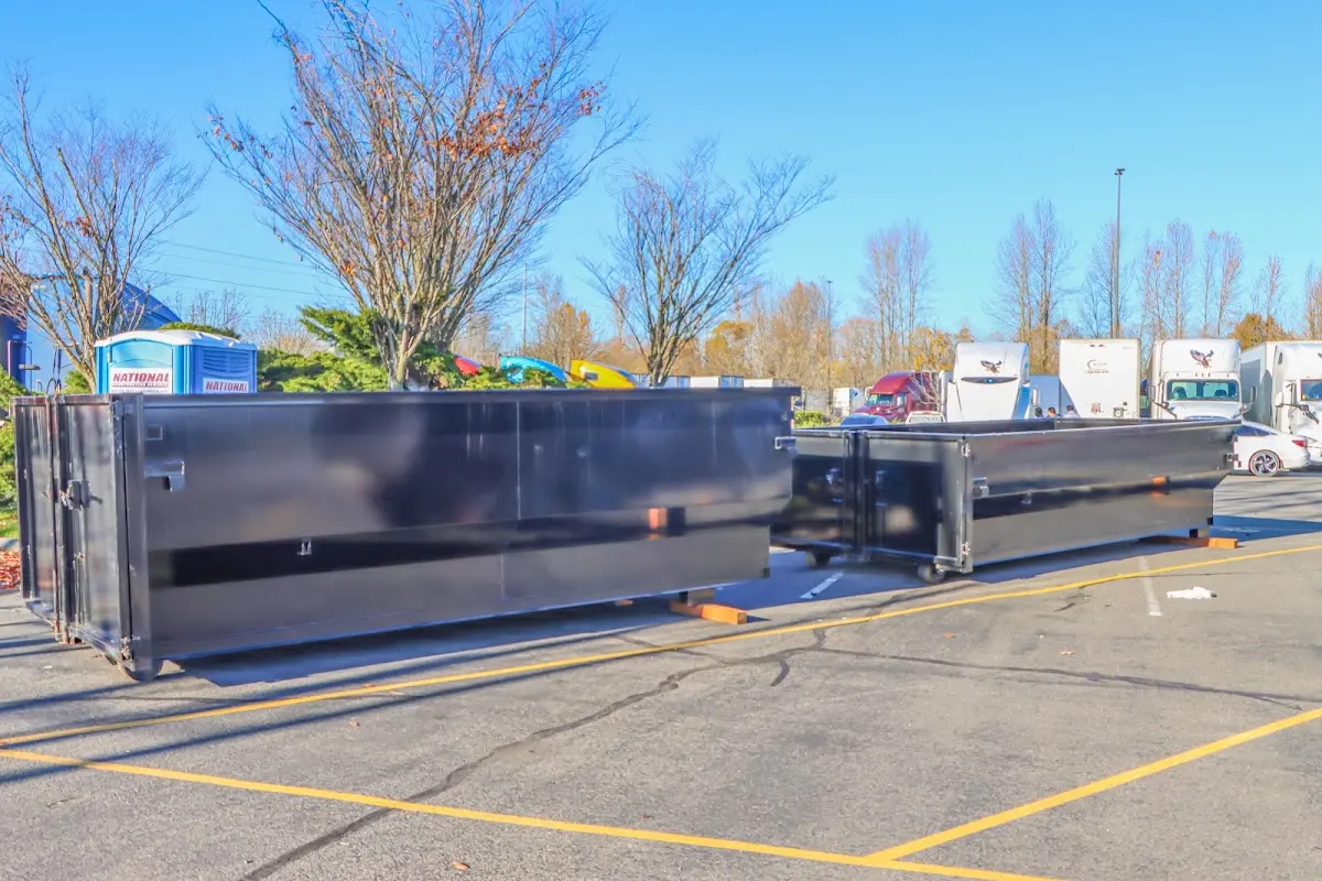 Professional dumpster rental service with roll-off container on residential driveway in Cusseta-Chattahoochee County